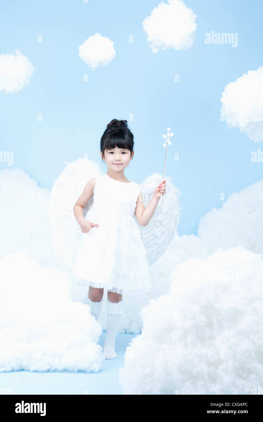little girl with looks of angel on the clouds Stock Photo - Alamy