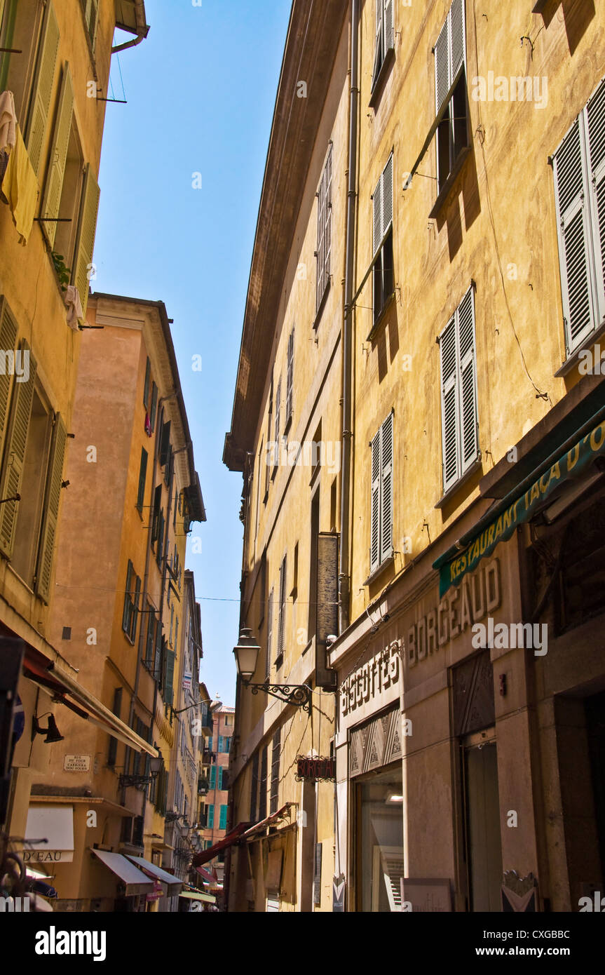 Narrow street in the old town of Nice - France Stock Photo