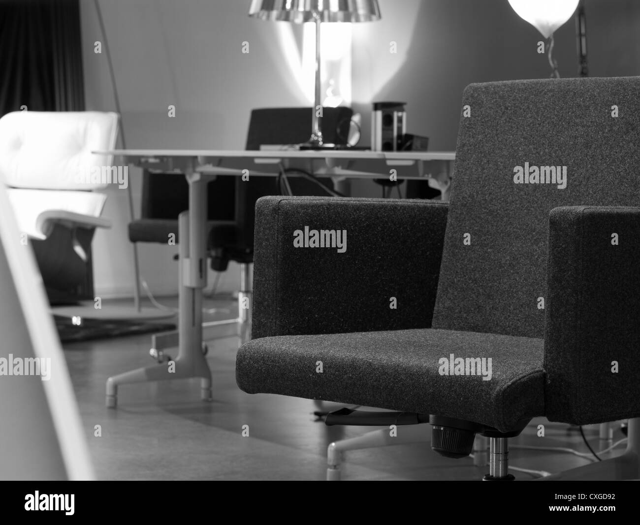 Lensvelt AVL office chair in front of a designer office with fancy lamps Stock Photo