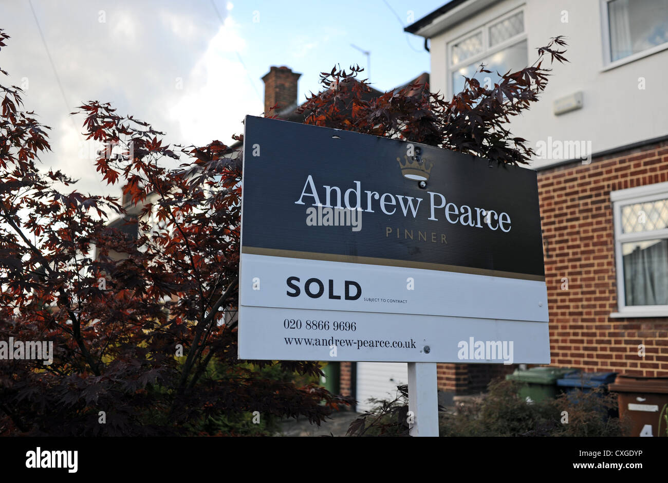 Andrew Pearce estate agent board outside a property which they have sold in  Pinner Middlesex Britain UK Stock Photo - Alamy