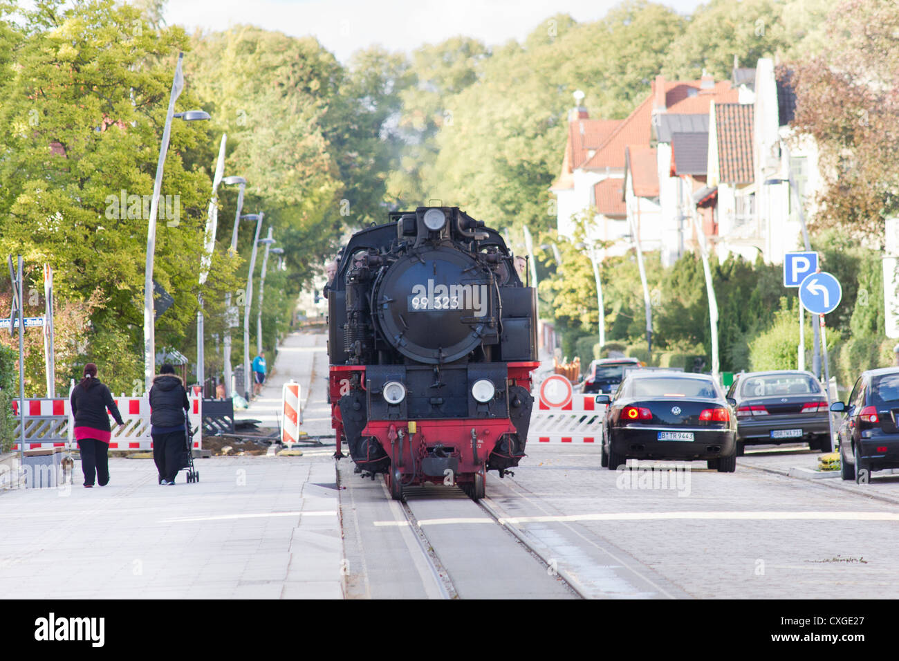 Steam locomotive pulling a  passenger train. The Molli bahn at Bad Doberan - Germany Stock Photo