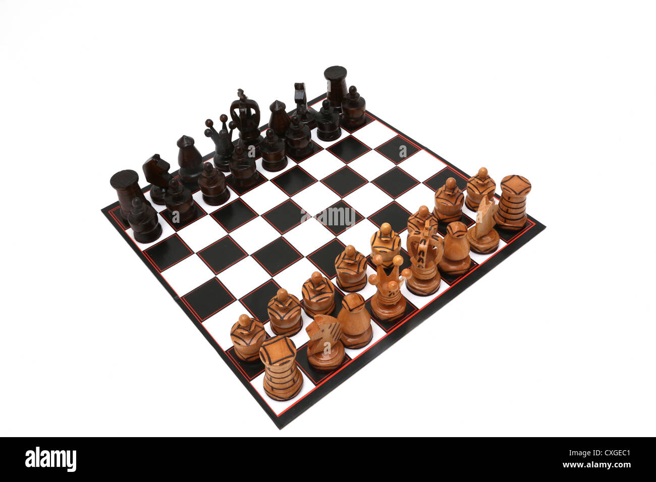 Chess Board With Carved Wooden Chess Pieces Stock Photo