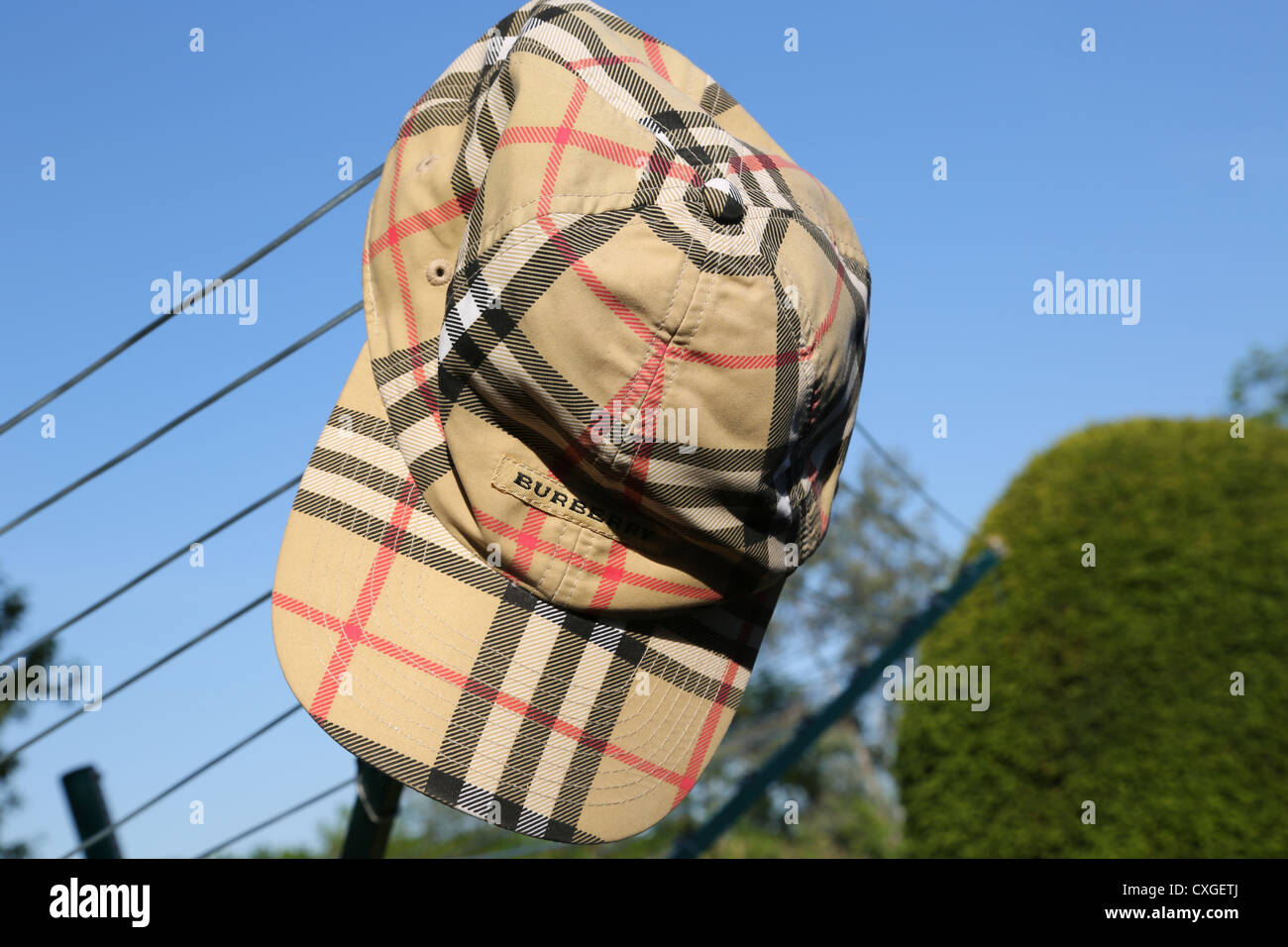 Burberry Golf Cap Hanging on Washing Line Stock Photo - Alamy