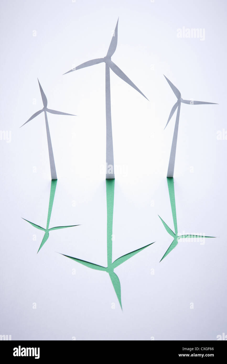 Three wind turbines with green shadows Stock Photo - Alamy
