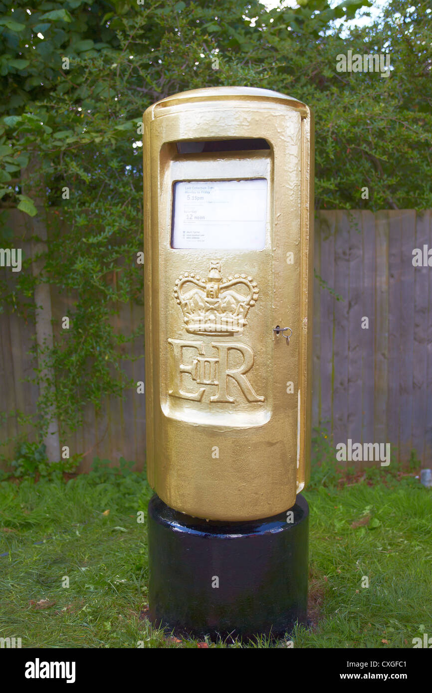 A gold postbox outside Stoke Mandeville Hospital, birthplace of the Paralympic Games. Stock Photo