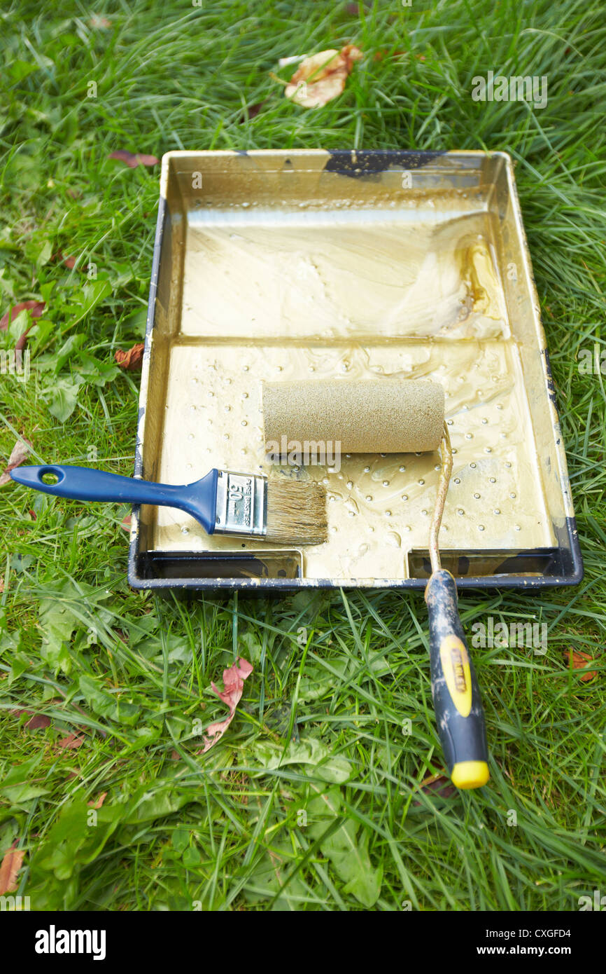 Gold paint being used to paint a postbox outside Stoke Mandeville Hospital, birthplace of the Paralympic Games Stock Photo