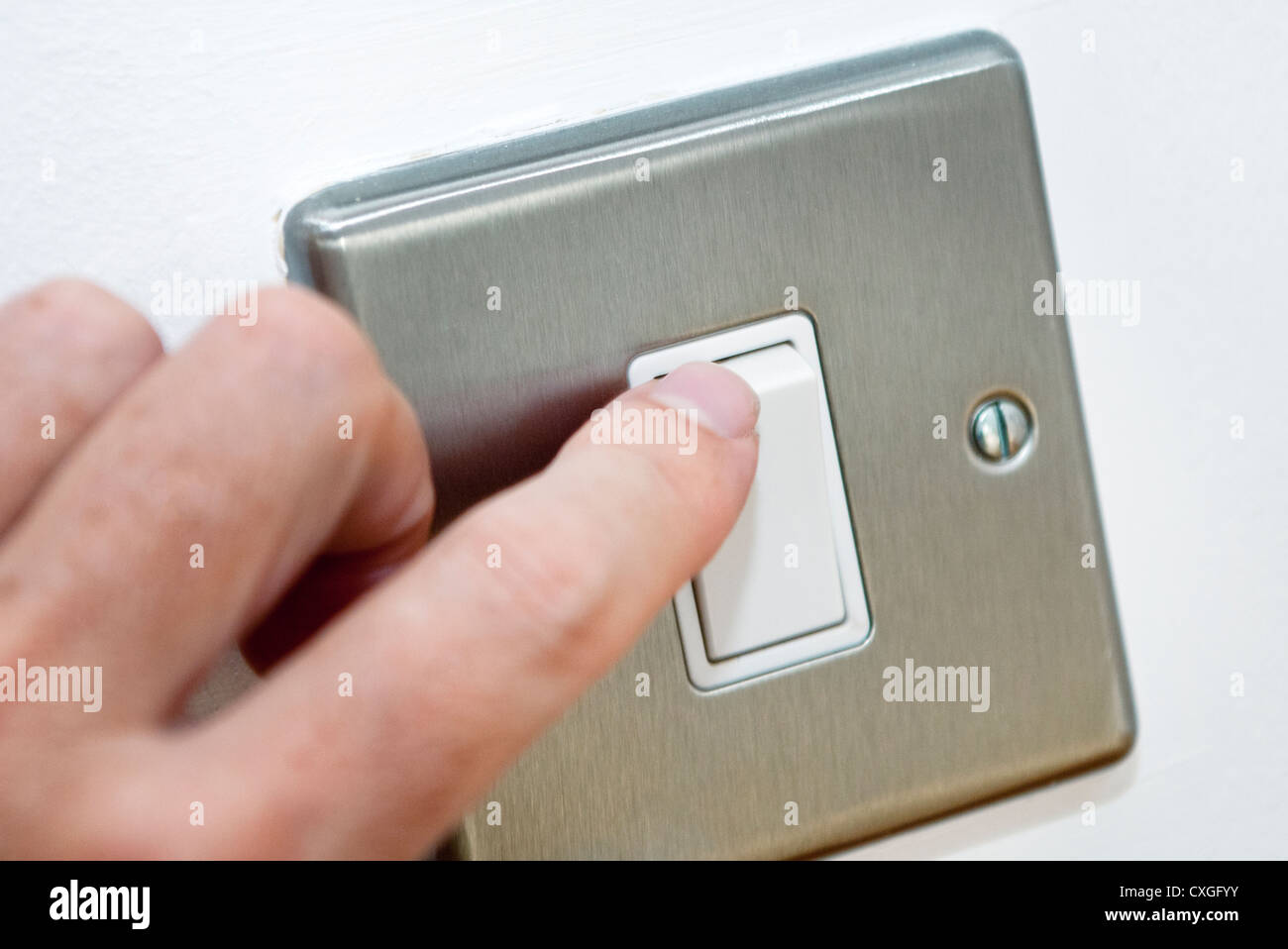 turning a light switch on Stock Photo Alamy