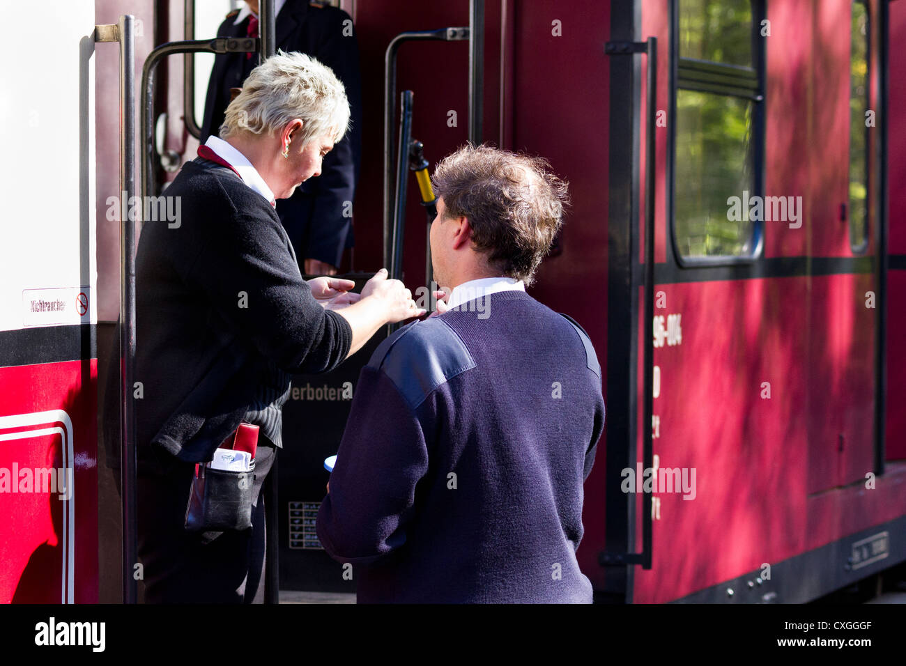 The Molli bahn at Bad Doberan - Germany.  Railway staff talking Stock Photo