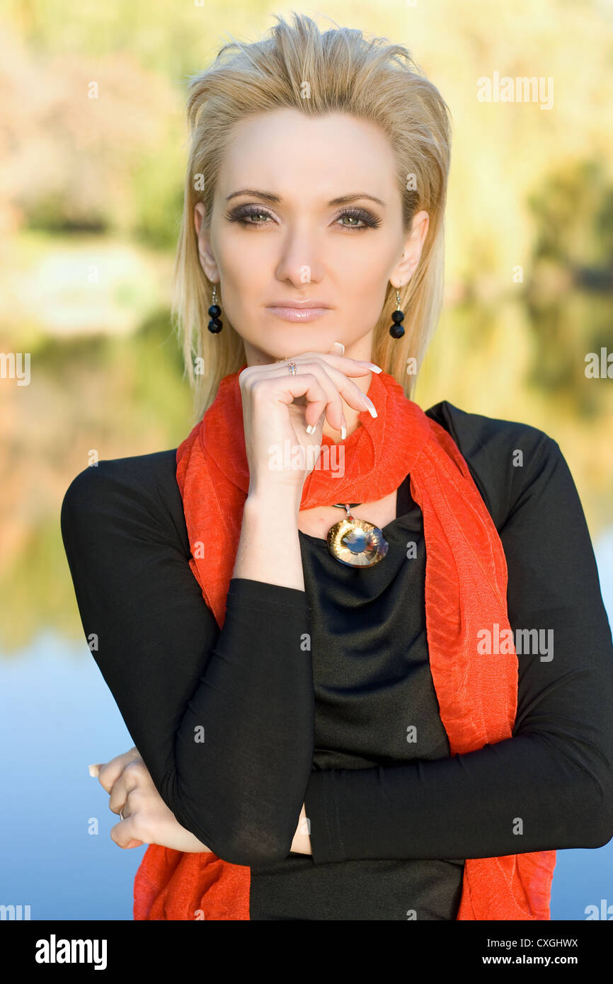 Portrait of a young blonde in autumn park Stock Photo - Alamy