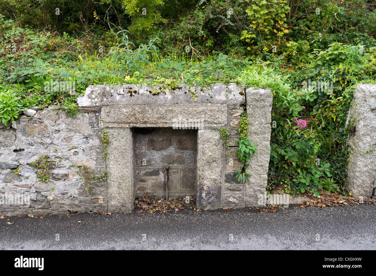 Old granite structure with remains of standpipe Stock Photo