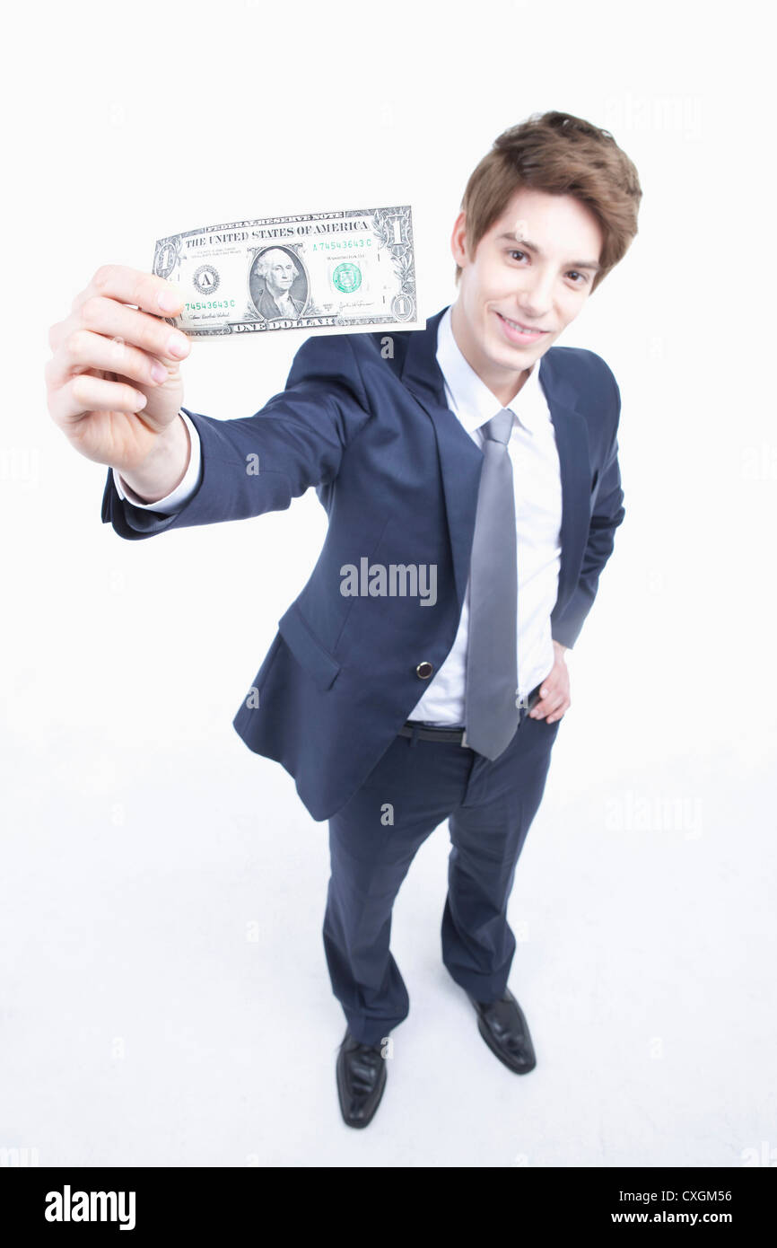 businessman holding a dollar bill on his hand Stock Photo - Alamy