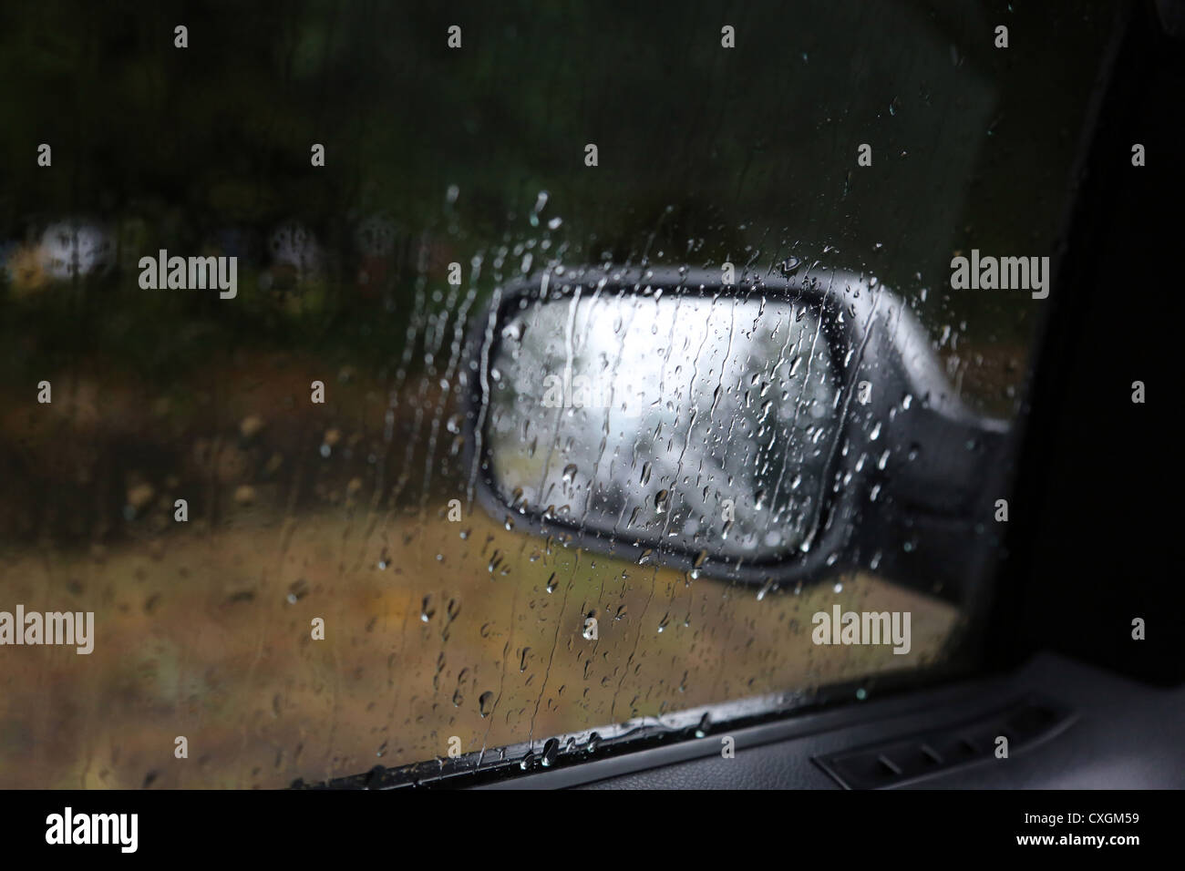 Wing Mirror In Rain Taken Through Car Window Stock Photo