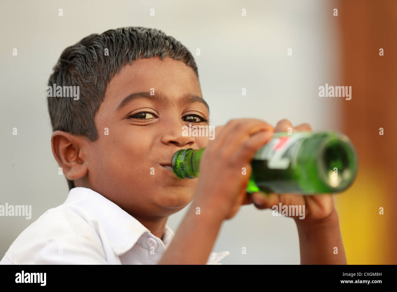 Indian boy carrying water bottle hi-res stock photography and images - Alamy