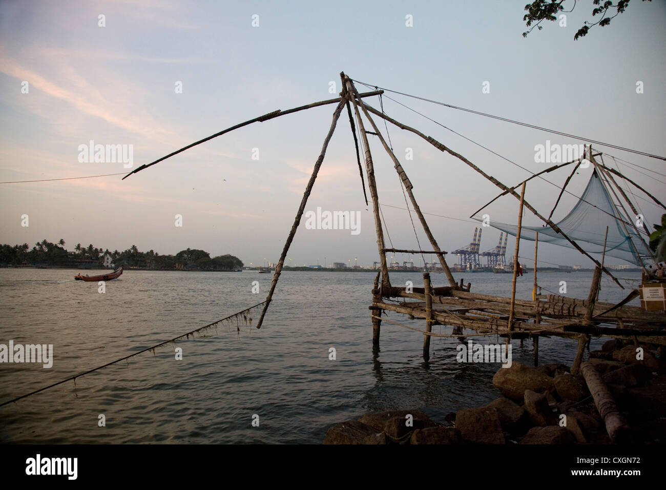Traditional Chinese fishing nets at sunset, Cochin, India. Stock Photo