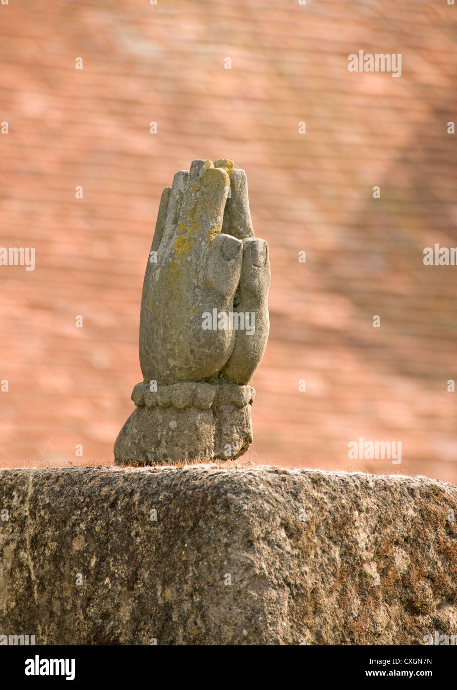 Stone praying hands Stock Photo - Alamy
