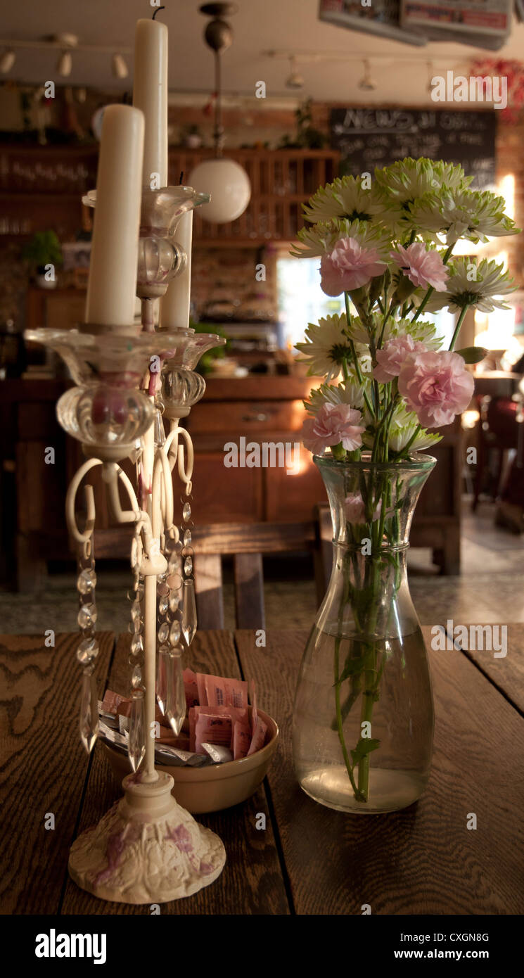 Candelabra and Flowers in a Café  in London Stock Photo