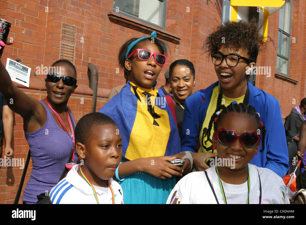 Group of Afro Caribbean women of mixed ages posing in street Stock Photo