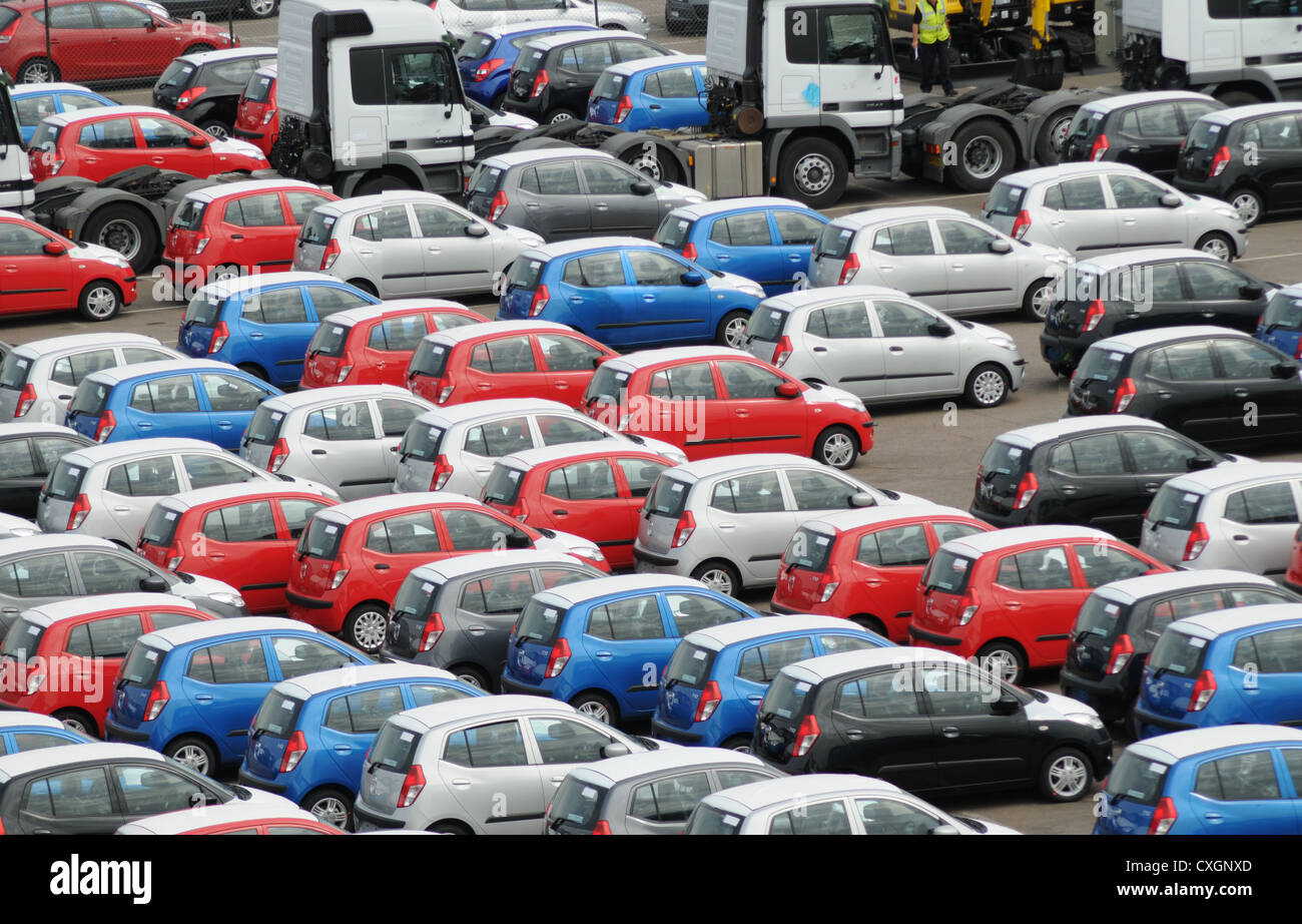 A car park of newly delivered cars at Tilbury dock all different colours Stock Photo