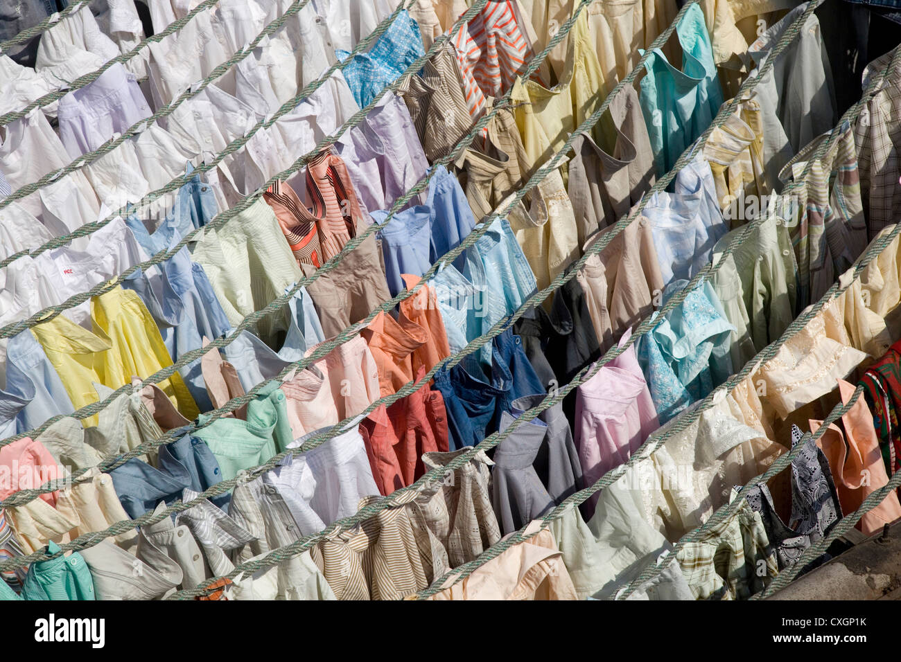 Colourful shirts hanging to dry at Dhobi Ghats central laundry, Mumbai, India. Stock Photo