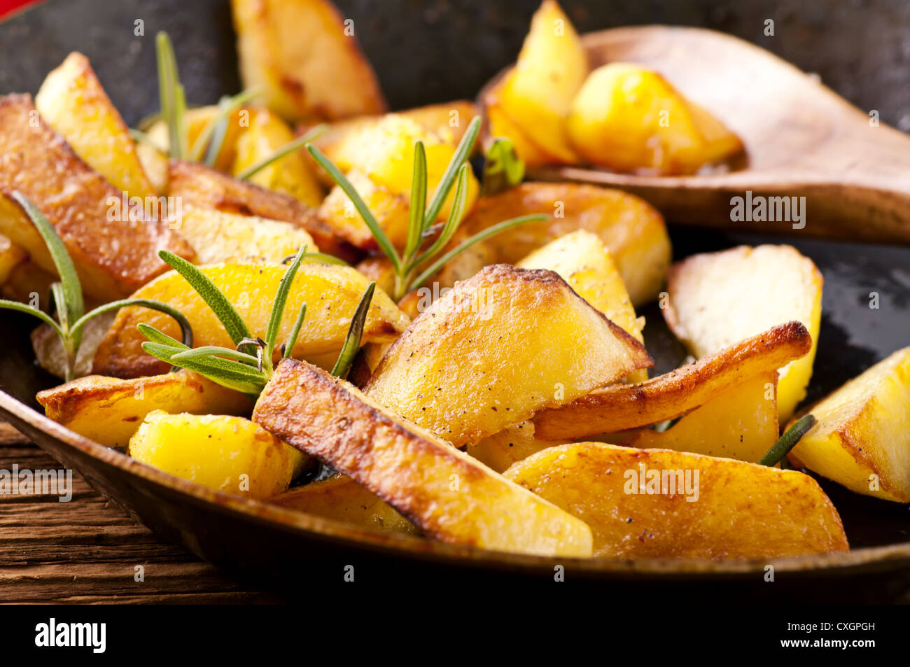 fried potato with herbs Stock Photo