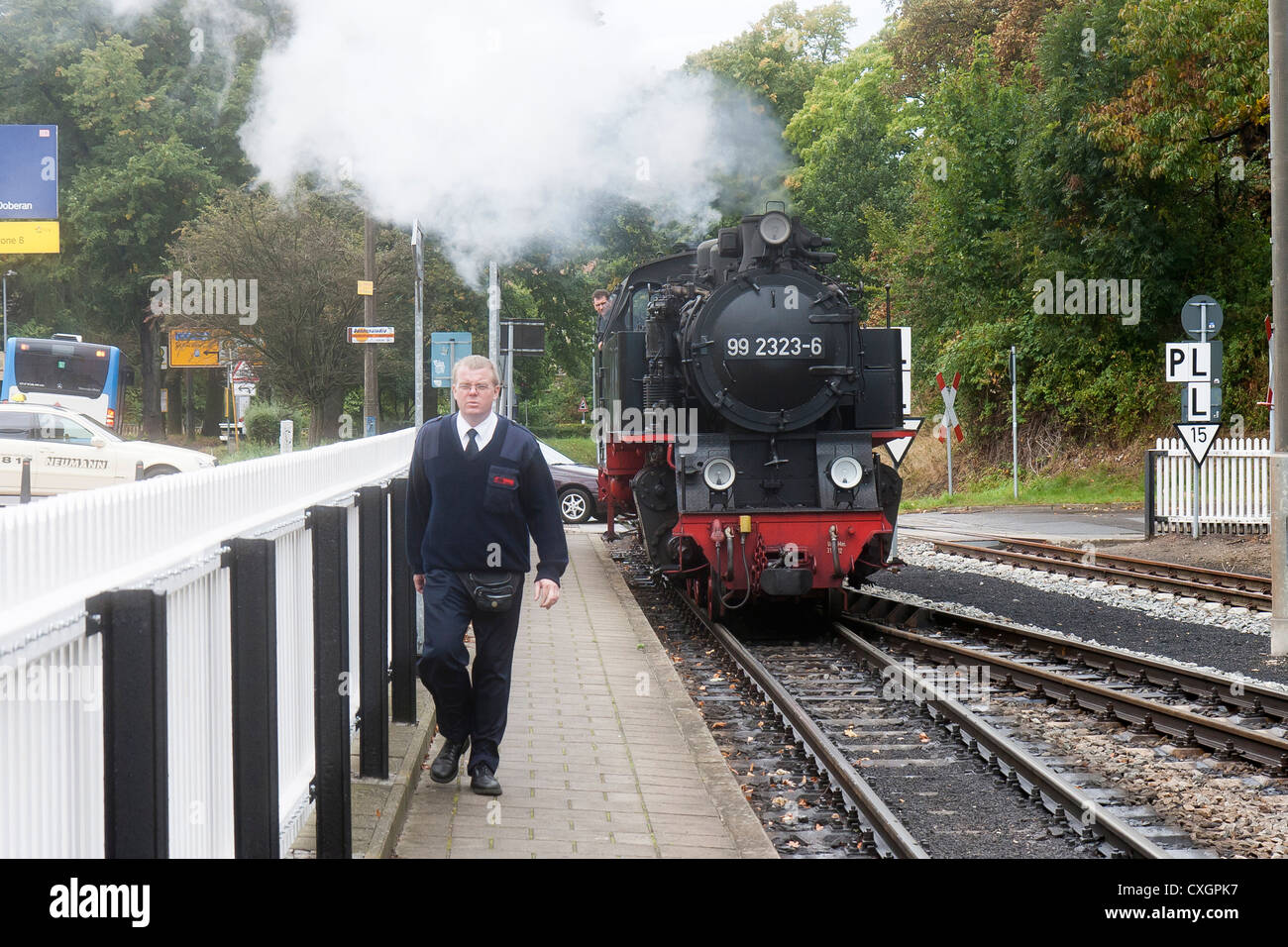 Steam locomotive and a railway worker. The Molli bahn at Bad Doberan - Germany Stock Photo