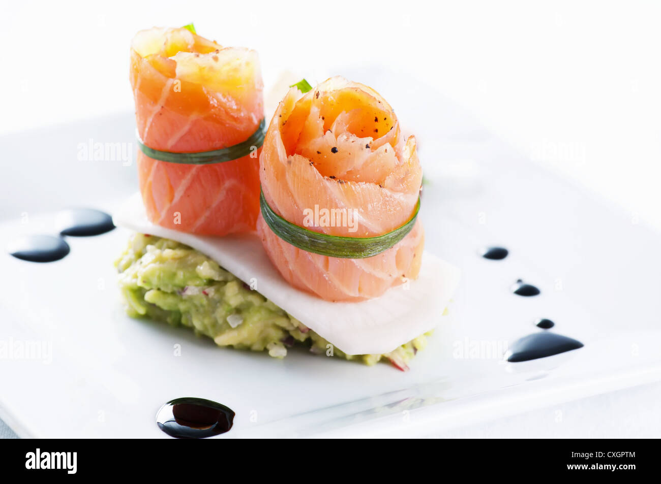 Salmon rolls with avocado cream Stock Photo