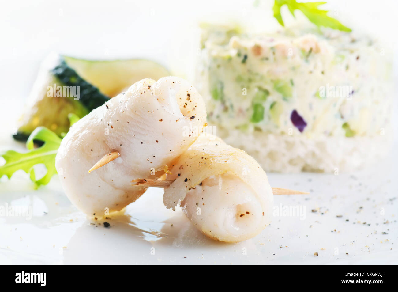 Grilled Fish rolls with avocado cream Stock Photo