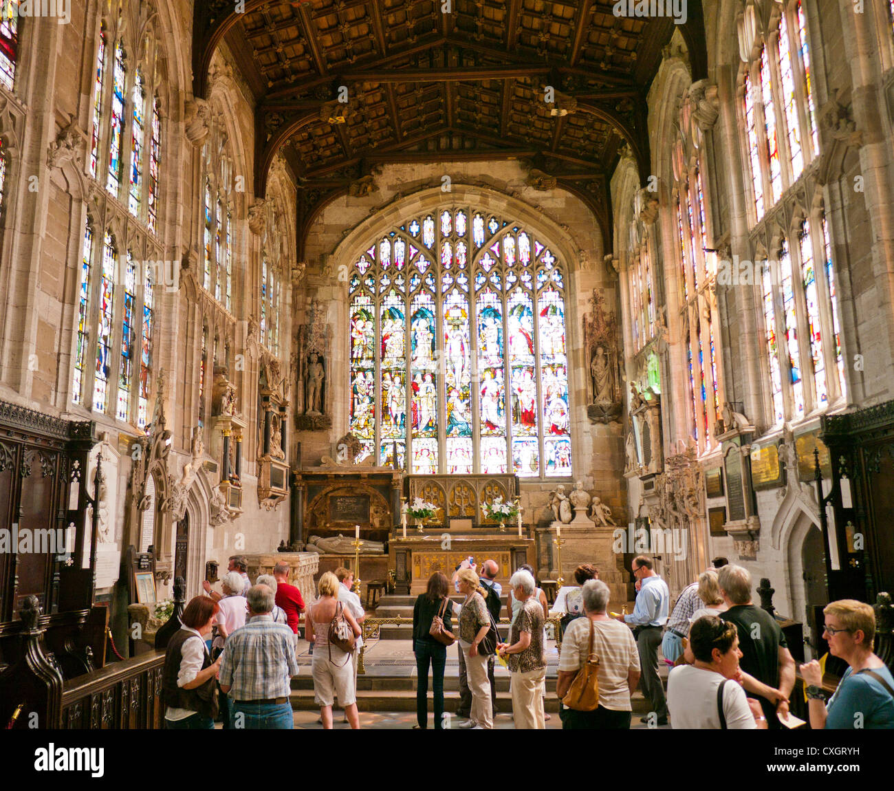 People inside Holy Trinity Church in Stratford upon Avon viewing the grave of William Shakespeare Stratford upon Avon in England Stock Photo