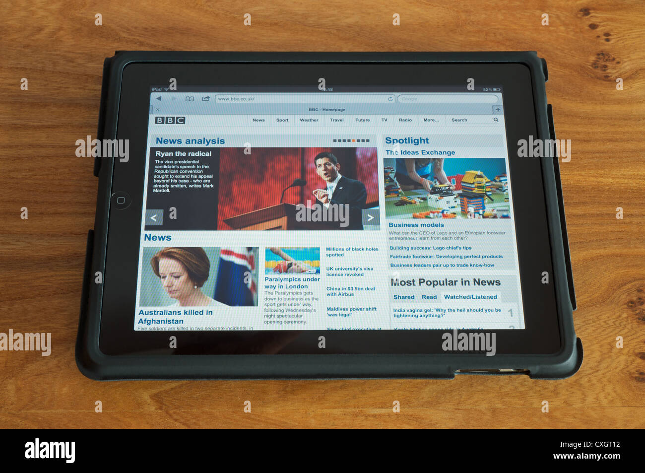 Tablet computer displaying the BBC news page Stock Photo