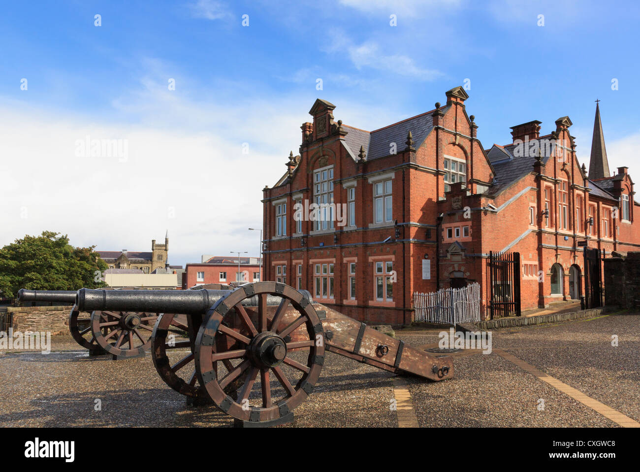 Cannon on old city walls by Verbal Arts Centre in refurbished First Derry School building. Co Londonderry Northern Ireland UK Stock Photo