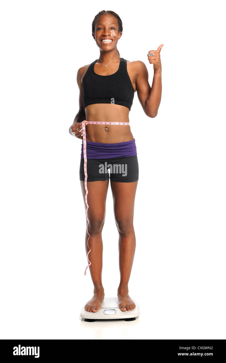 Black woman measuring waistline hi-res stock photography and images - Alamy