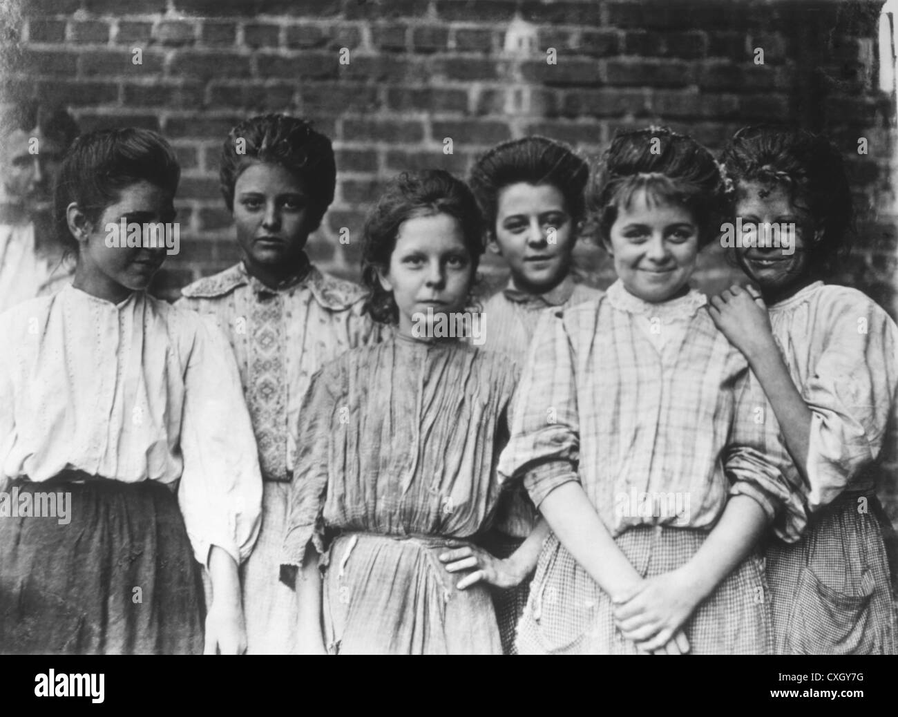 Group of Girls Enjoying Break at Cotton Mill, Georgia, USA, Photograph by Lewis Wickes Hine, 1909 Stock Photo