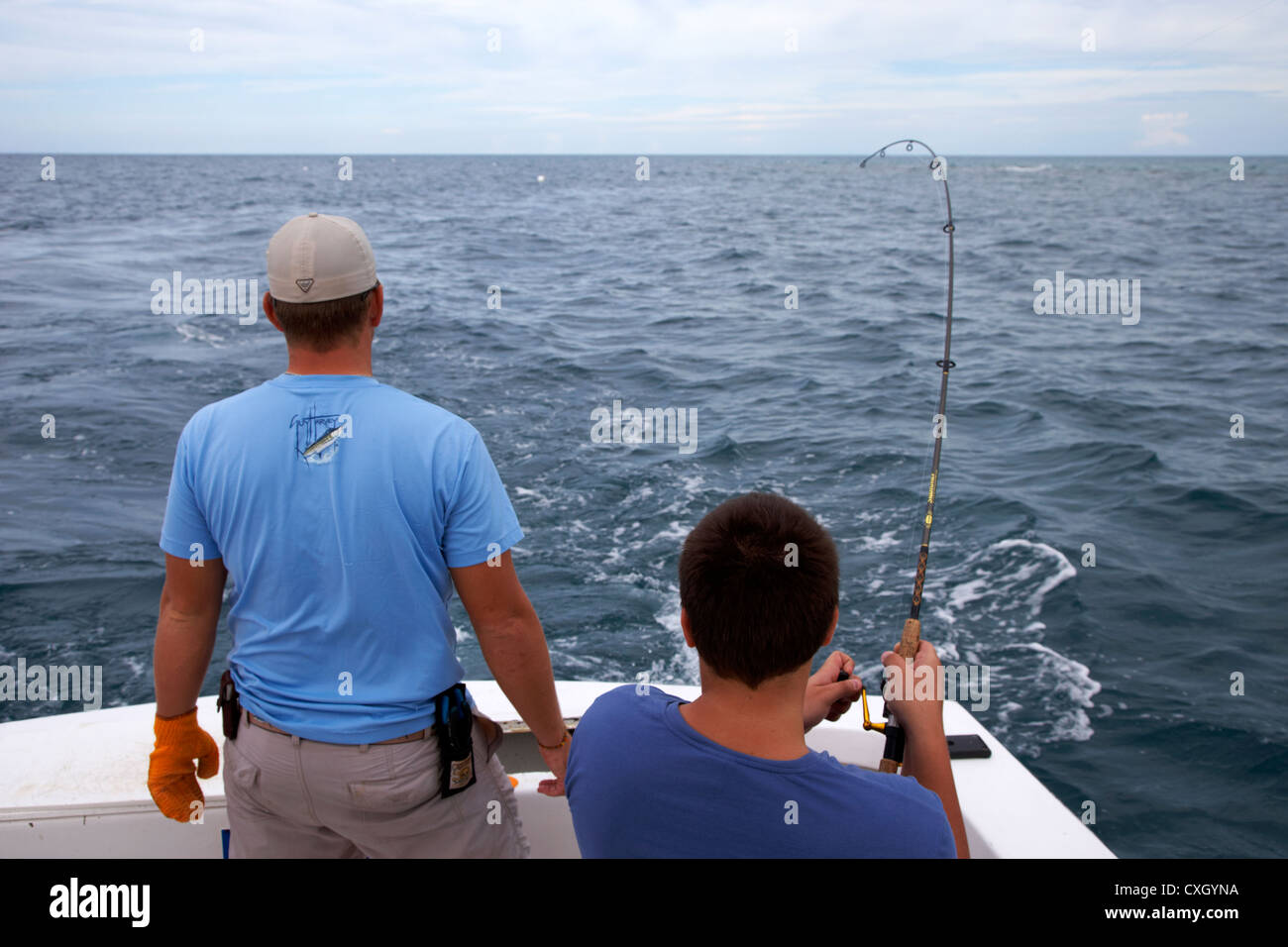Sport fish charter boat troll fishing for salmon using downriggers and rods  with single action reels Stock Photo - Alamy