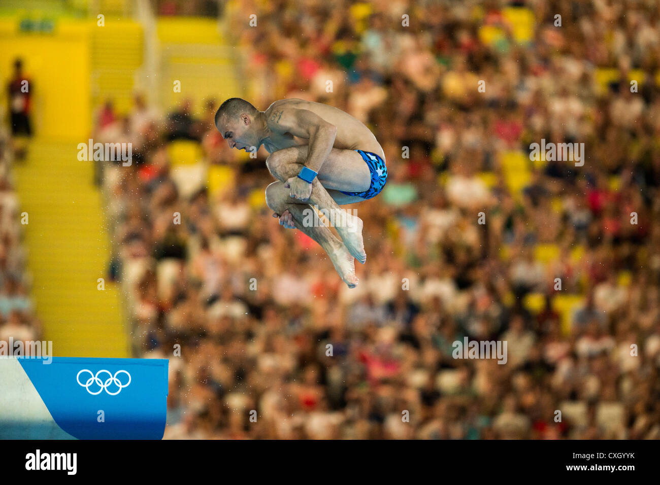 Male diver competing in 10m platform diving at the Olympic Summer Games