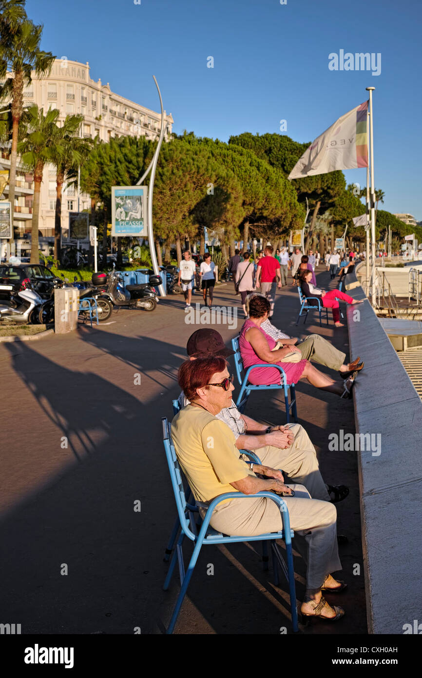 Relaxing on Cannes Seafront Stock Photo