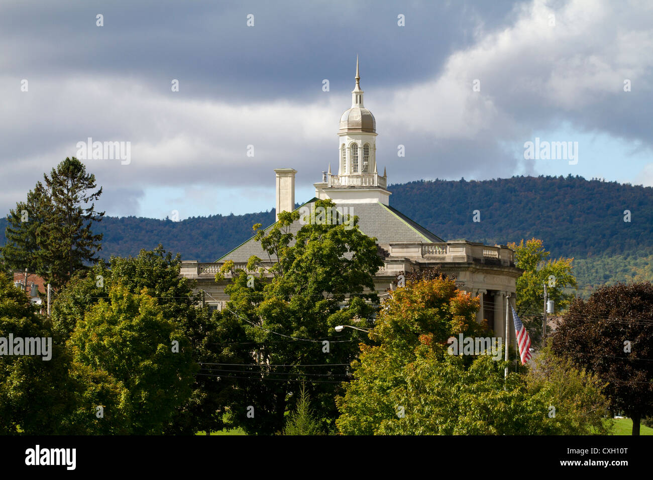 Town hall Ticonderoga New York USA America with trees and dark clouds