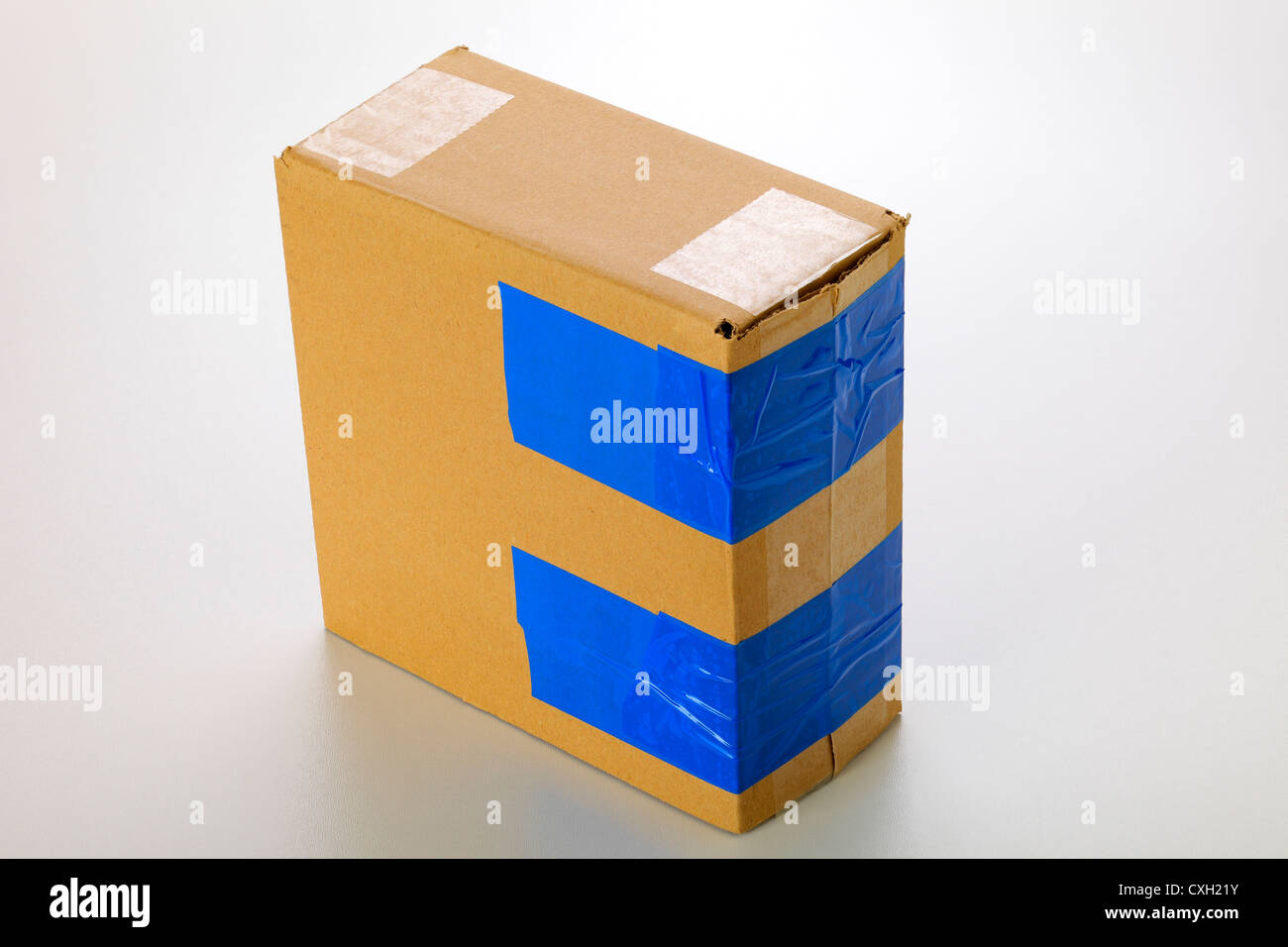 A cardboard box isolated on grey background Stock Photo - Alamy