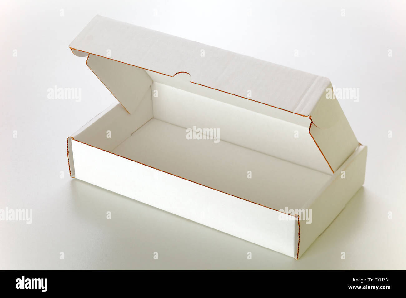 A open white cardboard box isolated on grey background Stock Photo - Alamy