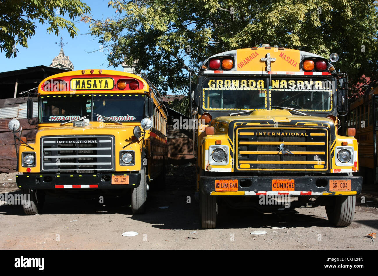Brightly decorated public buses (chicken buses) at Masaya bus station ...
