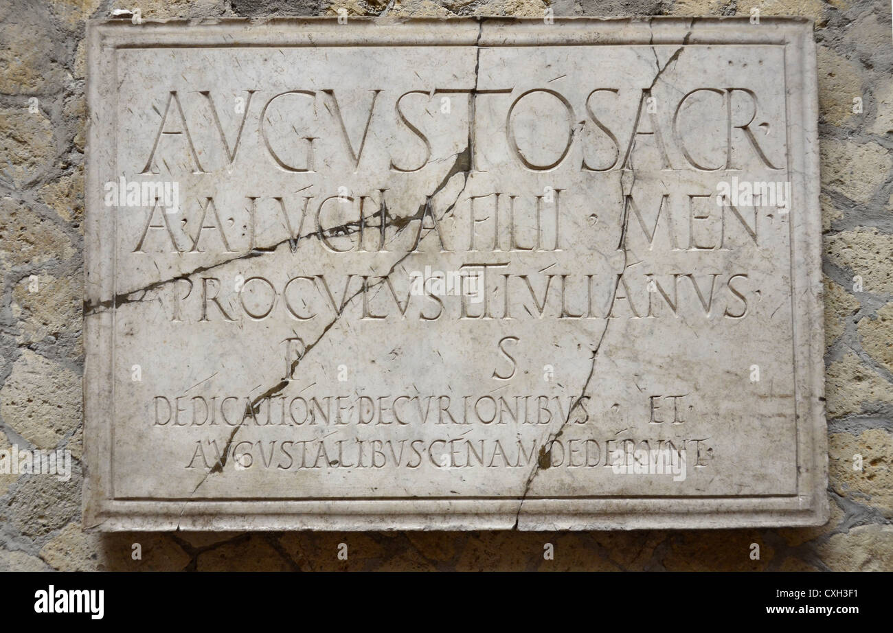 Herculaneum inscription at baths, put up by freed slaves libertus Stock Photo