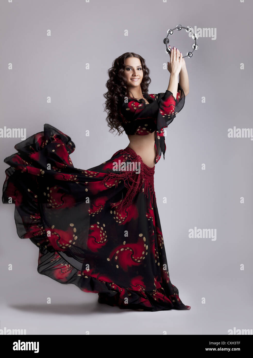 Young woman dance flamenco with tambourine Stock Photo Alamy