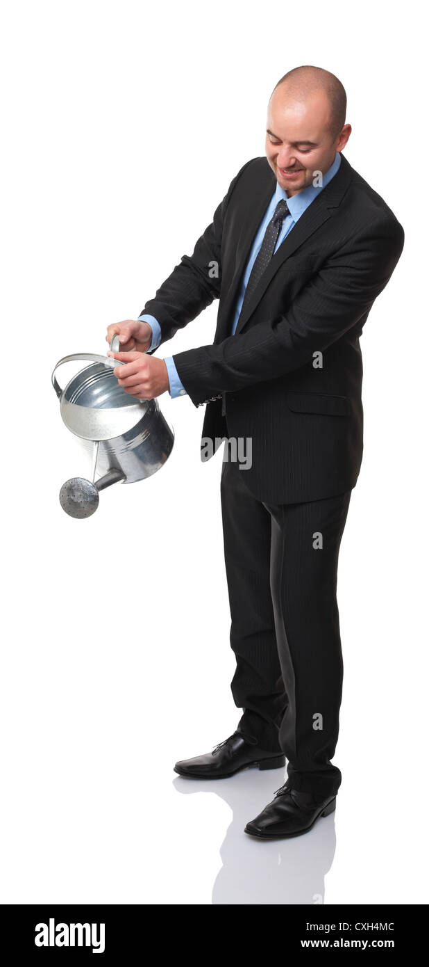 caucasian man watering action on white background Stock Photo