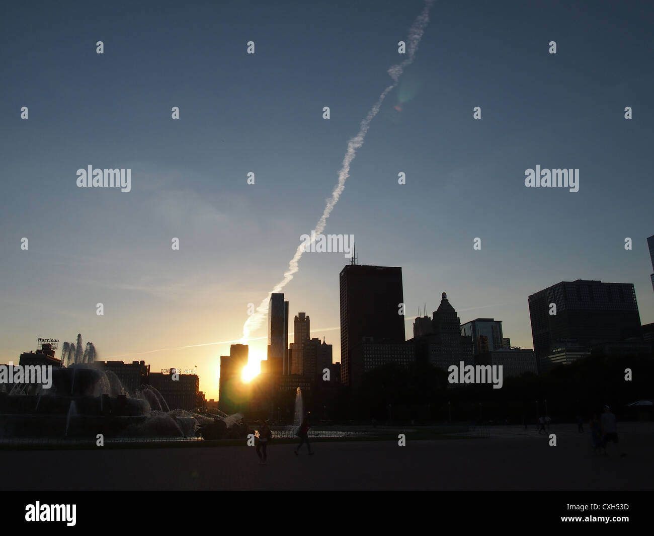 Dramatic View of Vapor-Trail on Chicago Skyline at Sunset Stock Photo