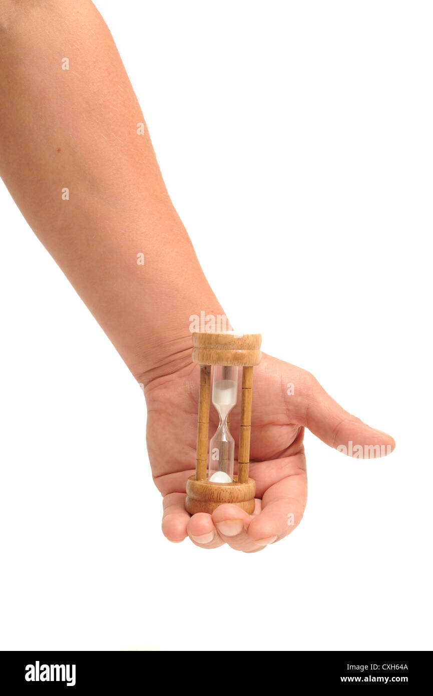 hand holding an egg timer isolated on a white background Stock Photo