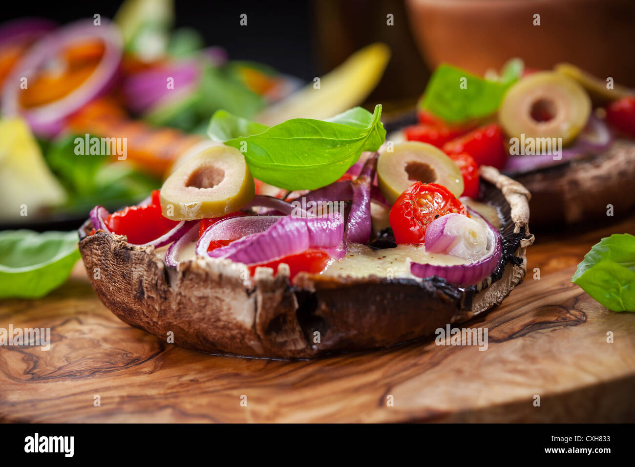 Giant Portobello mushrooms stuffed with mozzarella and tomatoes Stock Photo Alamy