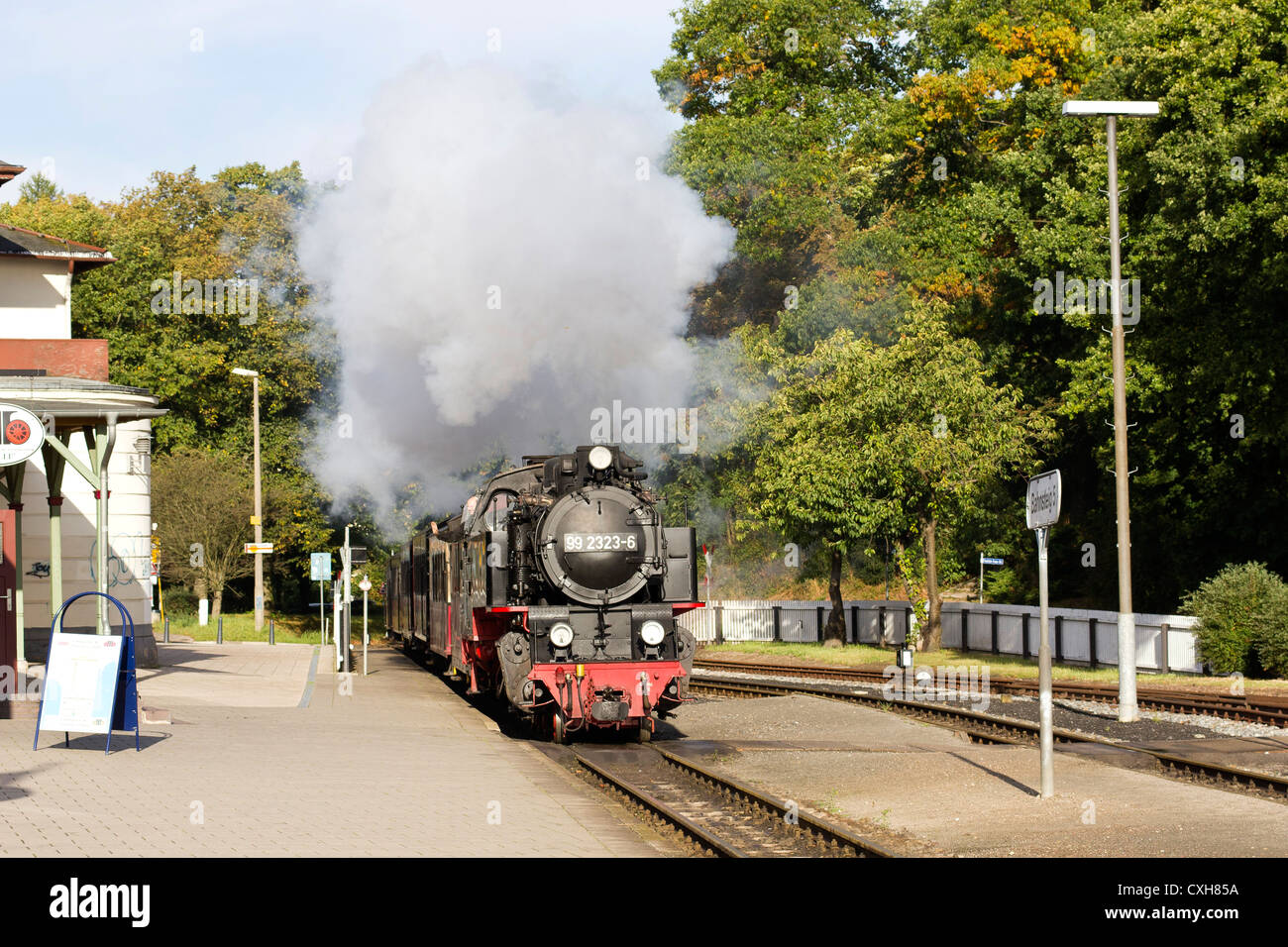 Steam locomotive pulling a passenger train. The Molli bahn at Bad Doberan - Germany Stock Photo