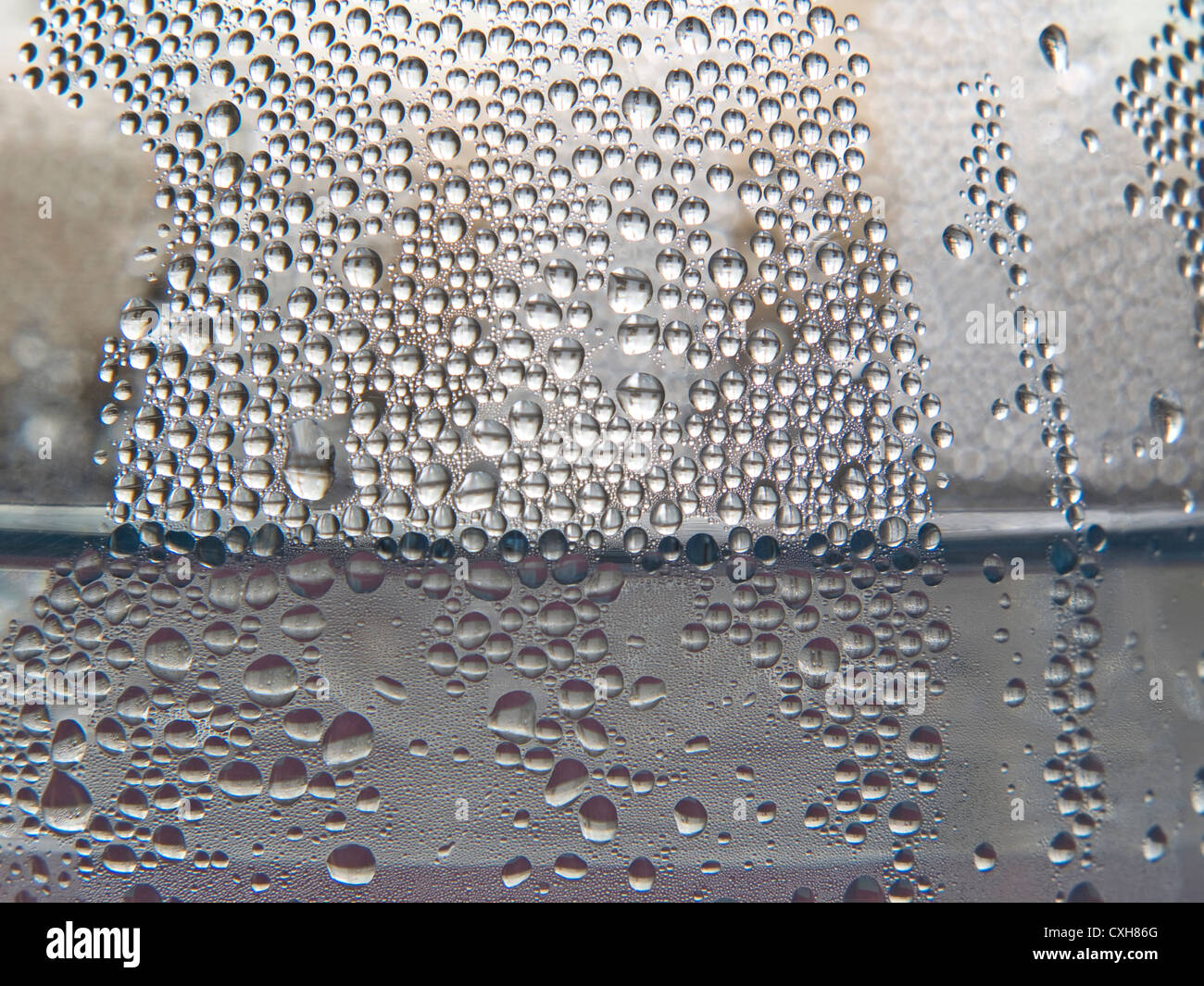 Monochrome water drops on taken closeup as background. Stock Photo