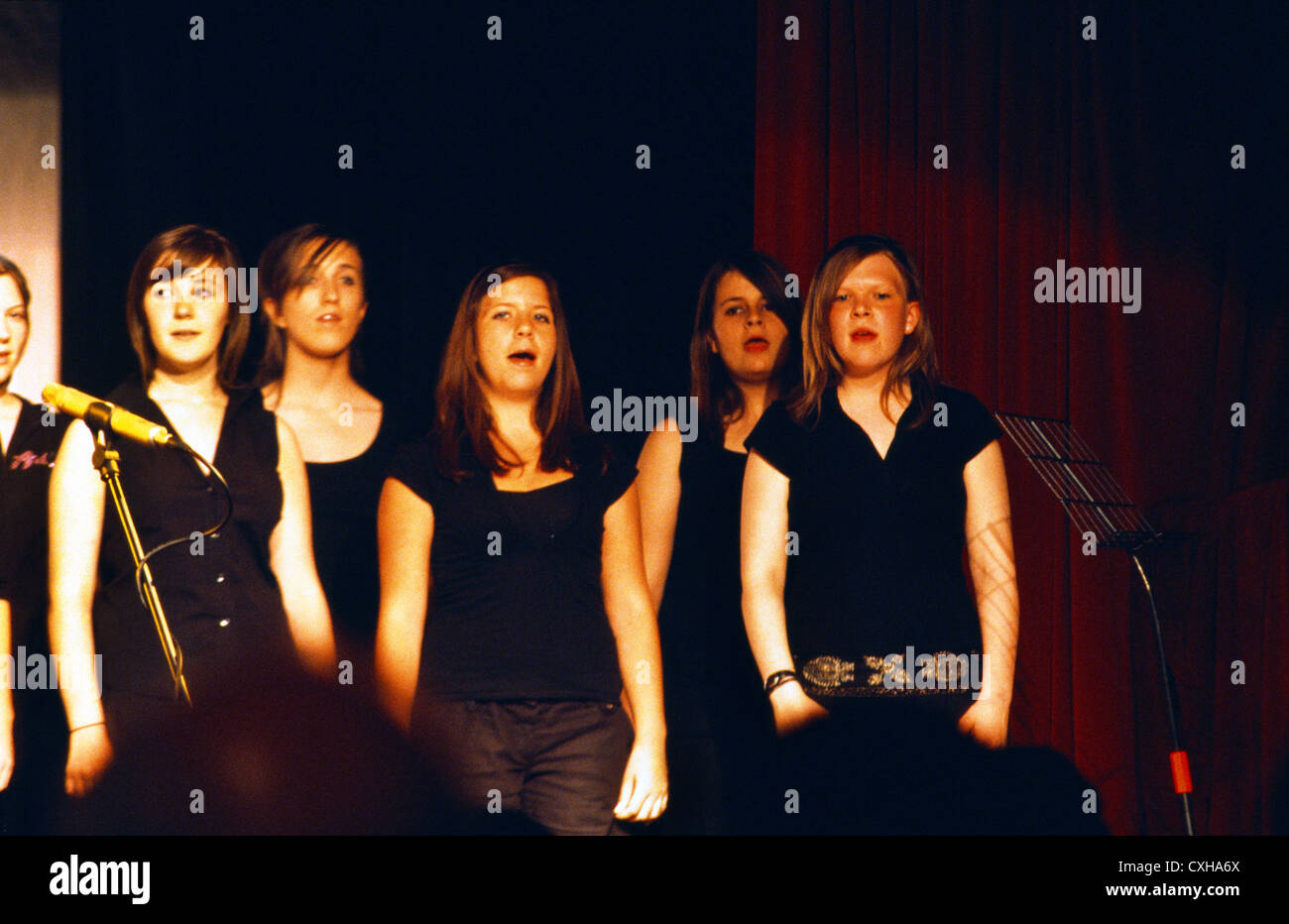 Teenage Girls Singing In Choir At A School Concert England Stock Photo