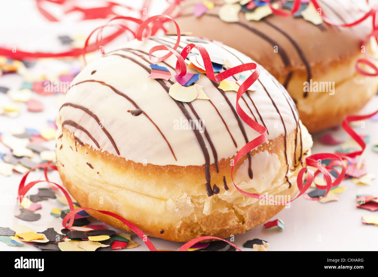 Krapfen with glaze and decoration Stock Photo