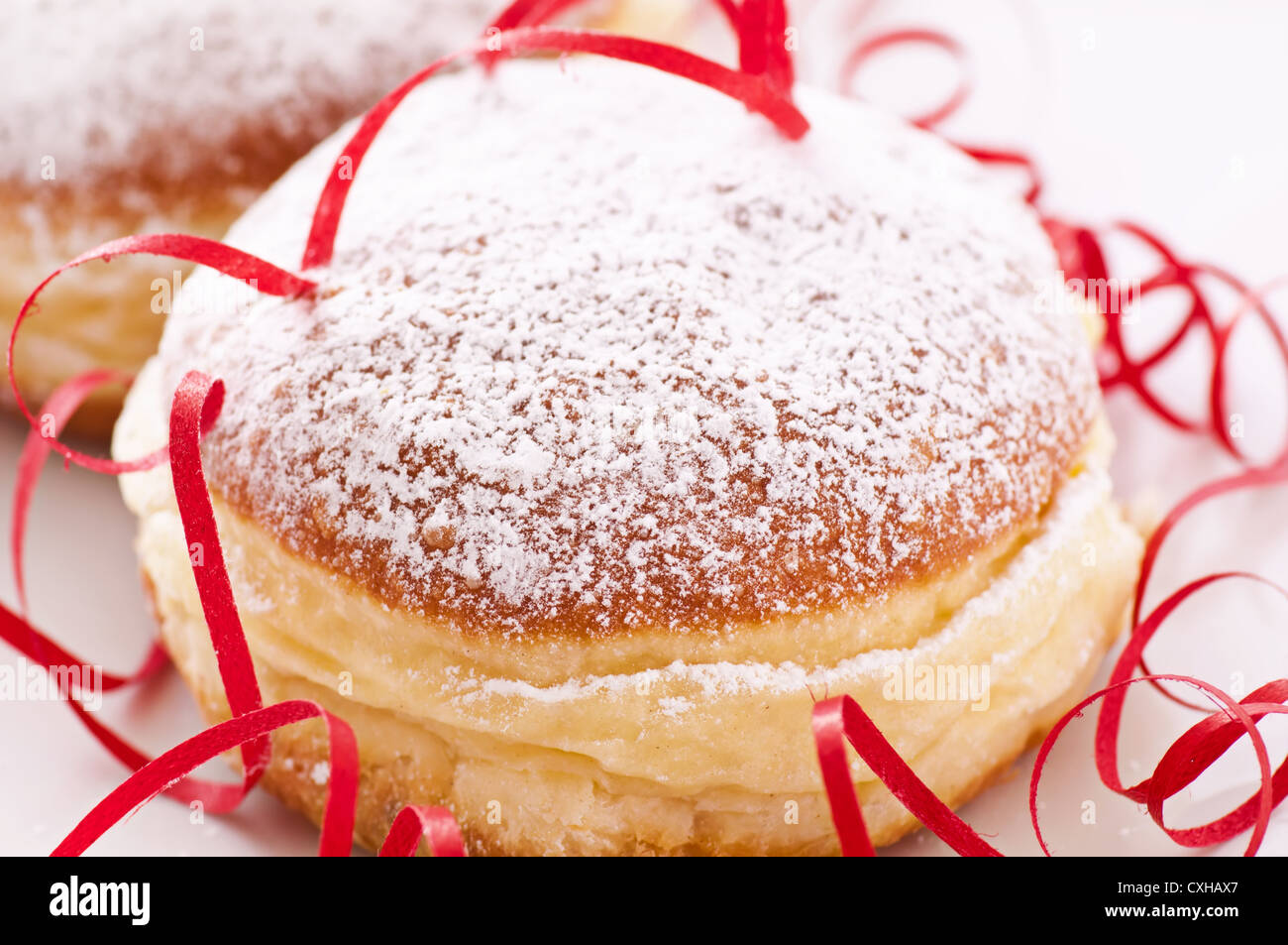 Berliner with icing sugar Stock Photo